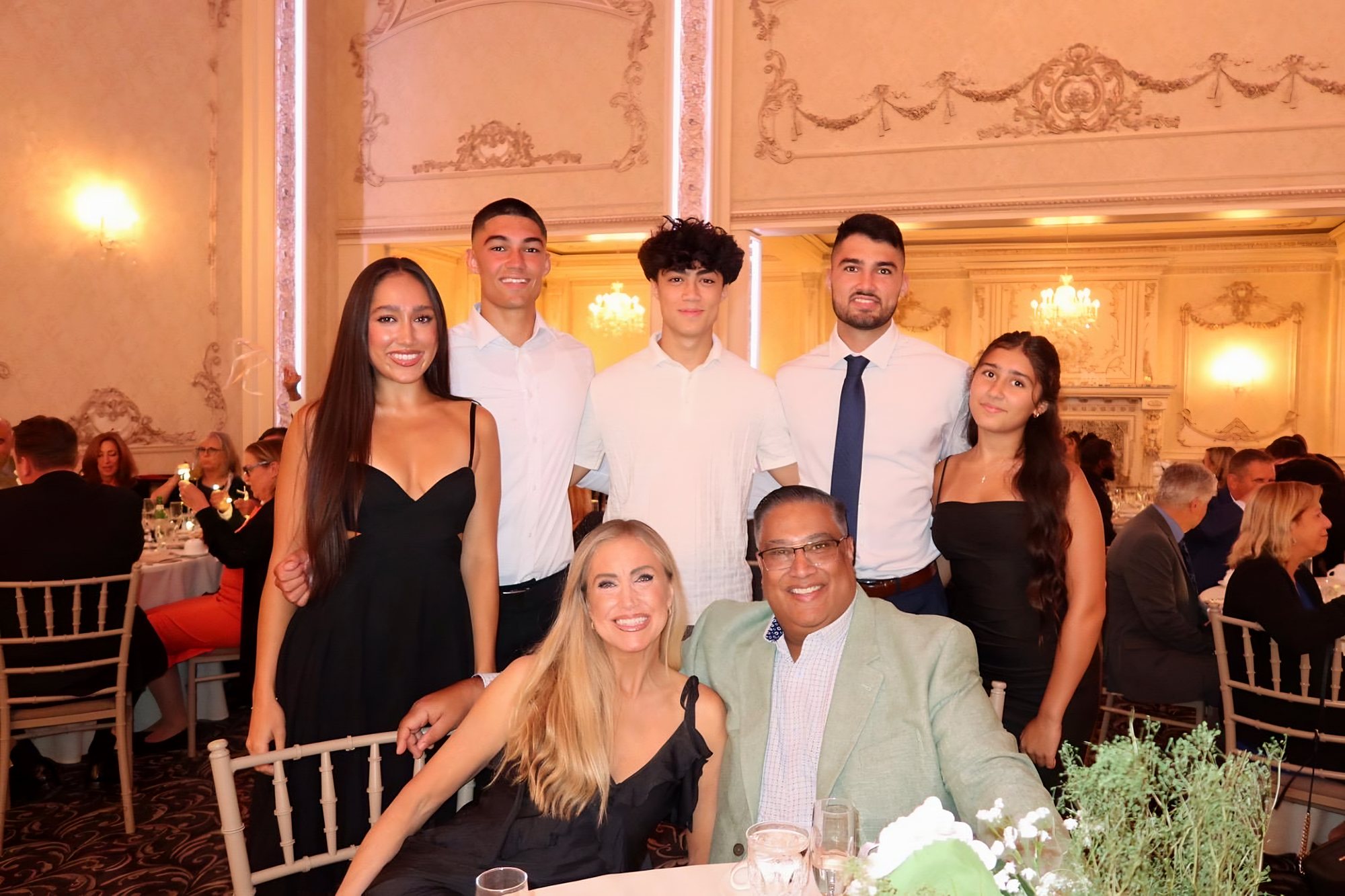 Neal Prasad with his wife Kimberly and their five children